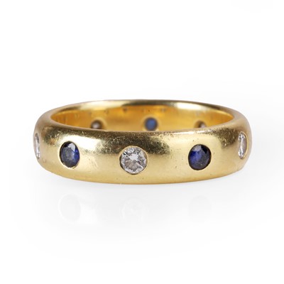 Lot 1086 - An 18ct gold sapphire and diamond band ring