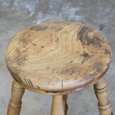 Lot 501 - A primitive pine milking stool