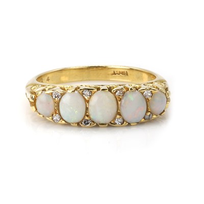 Lot 32 - An opal and diamond five stone ring