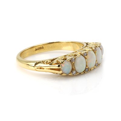 Lot 32 - An opal and diamond five stone ring