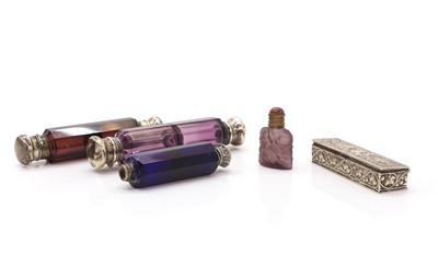 Lot 27 - A collection of silver-mounted glass scent bottles