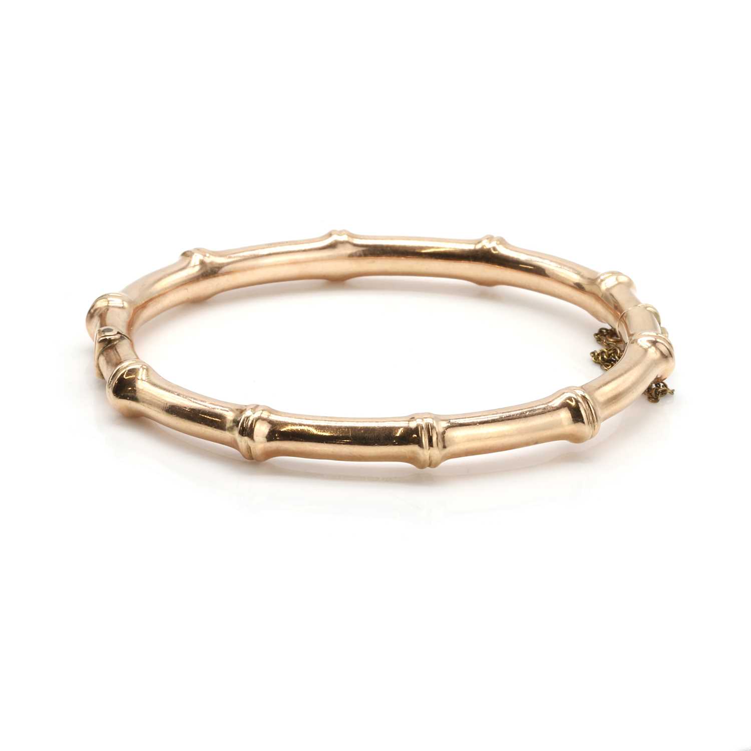 Lot 28 - An antique 9ct rose gold hinged bangle