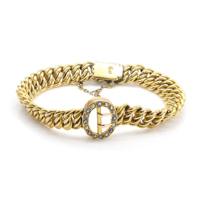 Lot 24 - An Edwardian split pearl and sapphire bracelet