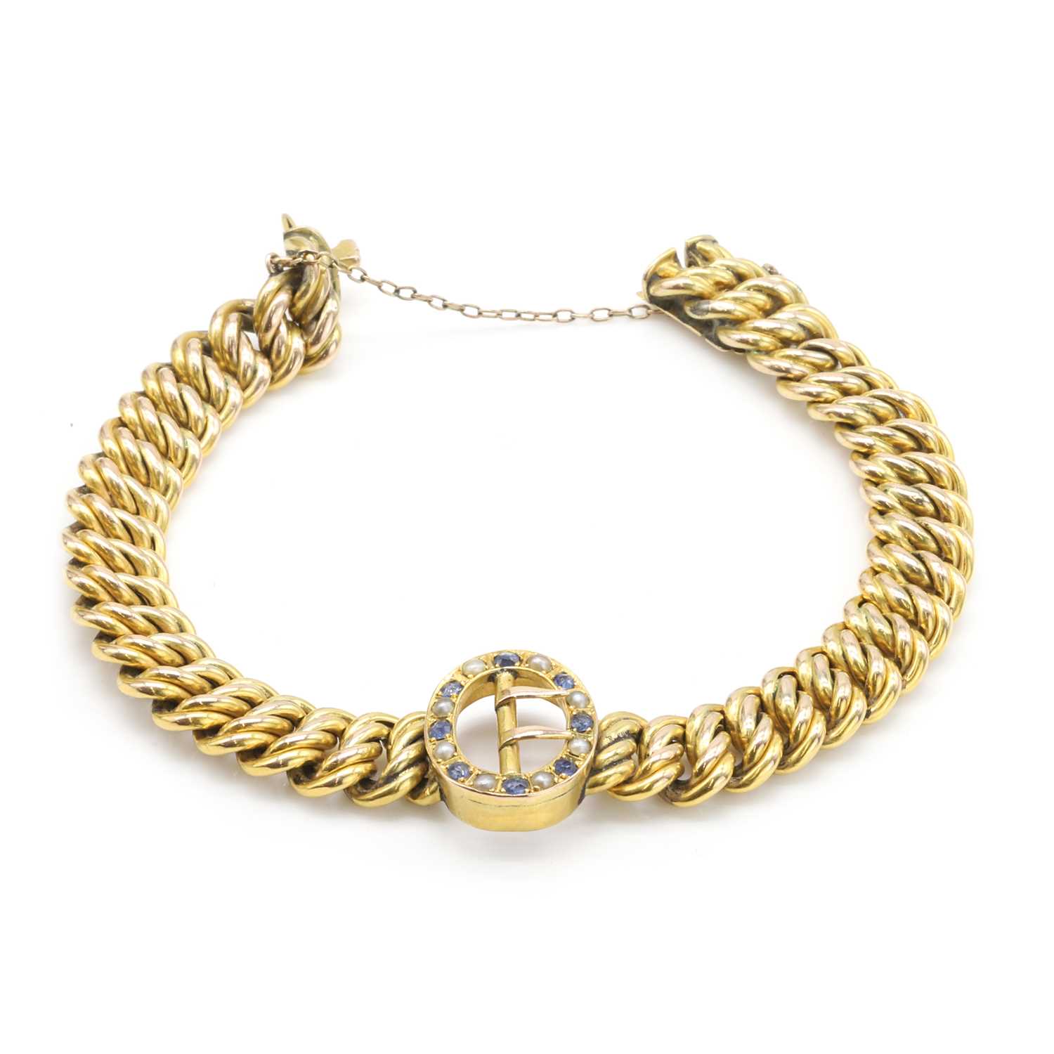 Lot 24 - An Edwardian split pearl and sapphire bracelet