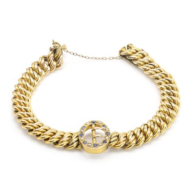 Lot 24 - An Edwardian split pearl and sapphire bracelet