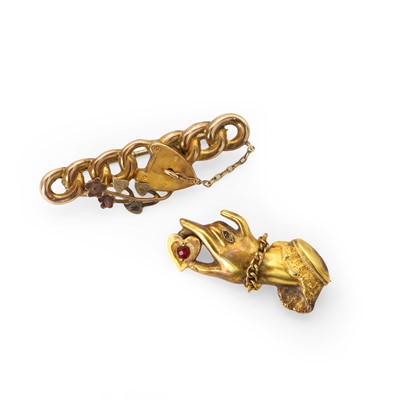 Lot 199 - An Edwardian 9ct gold hand and heart brooch and a Victorian brooch