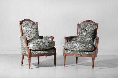 Lot 160 - A pair of Louis XVI-style walnut and beech bergères