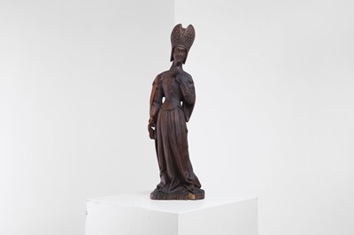 Lot 120 - A carved walnut figure of a woman
