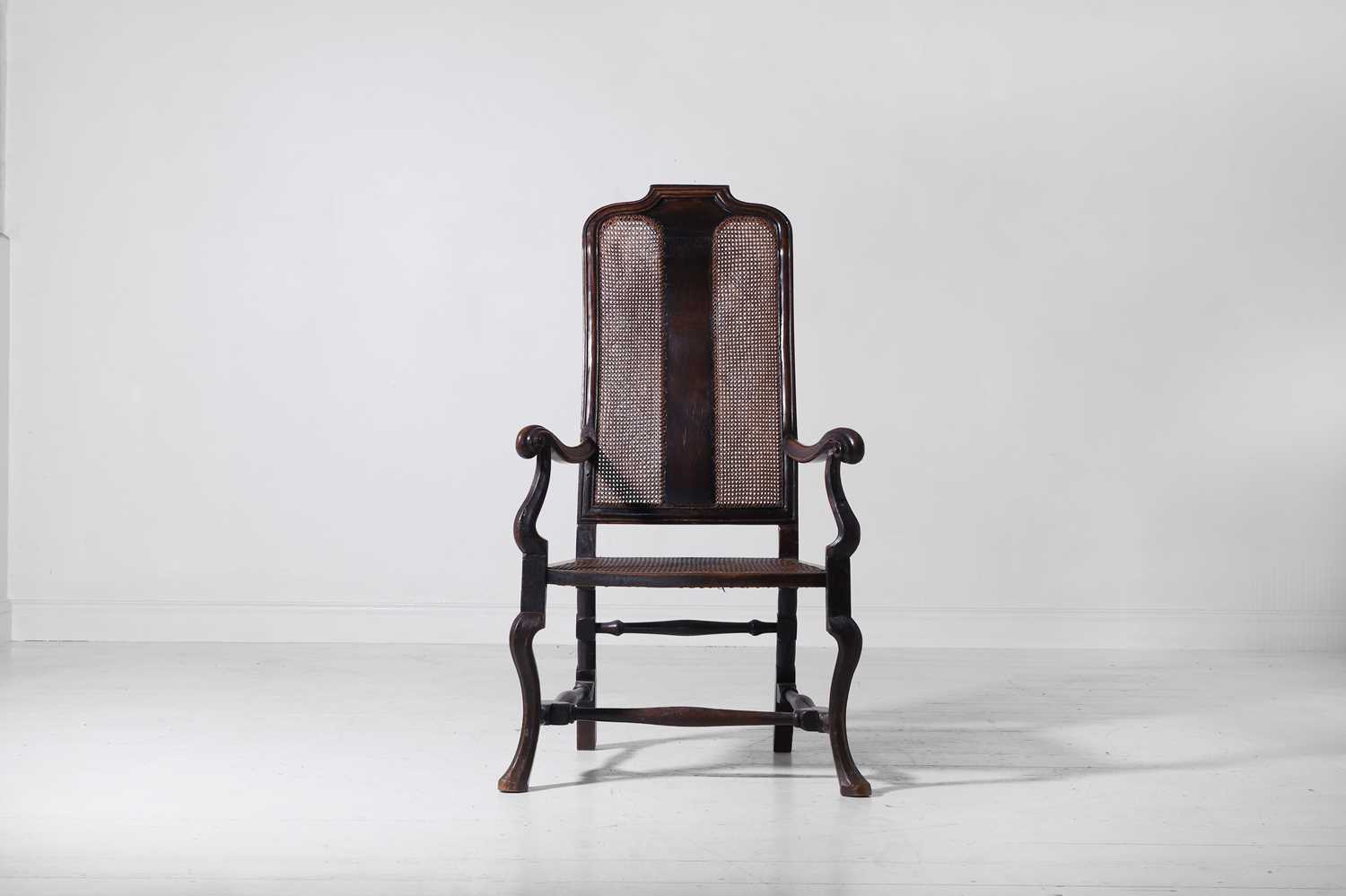 Lot 278 - A baroque walnut and cane open armchair