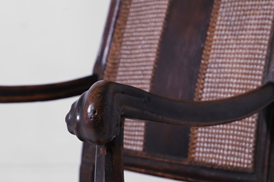 Lot 278 - A baroque walnut and cane open armchair