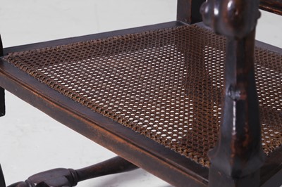 Lot 278 - A baroque walnut and cane open armchair
