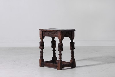 Lot 89 - An Elizabeth I-style carved oak joint stool