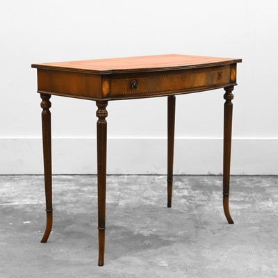 Lot 530 - An inlaid mahogany bow fronted writing table