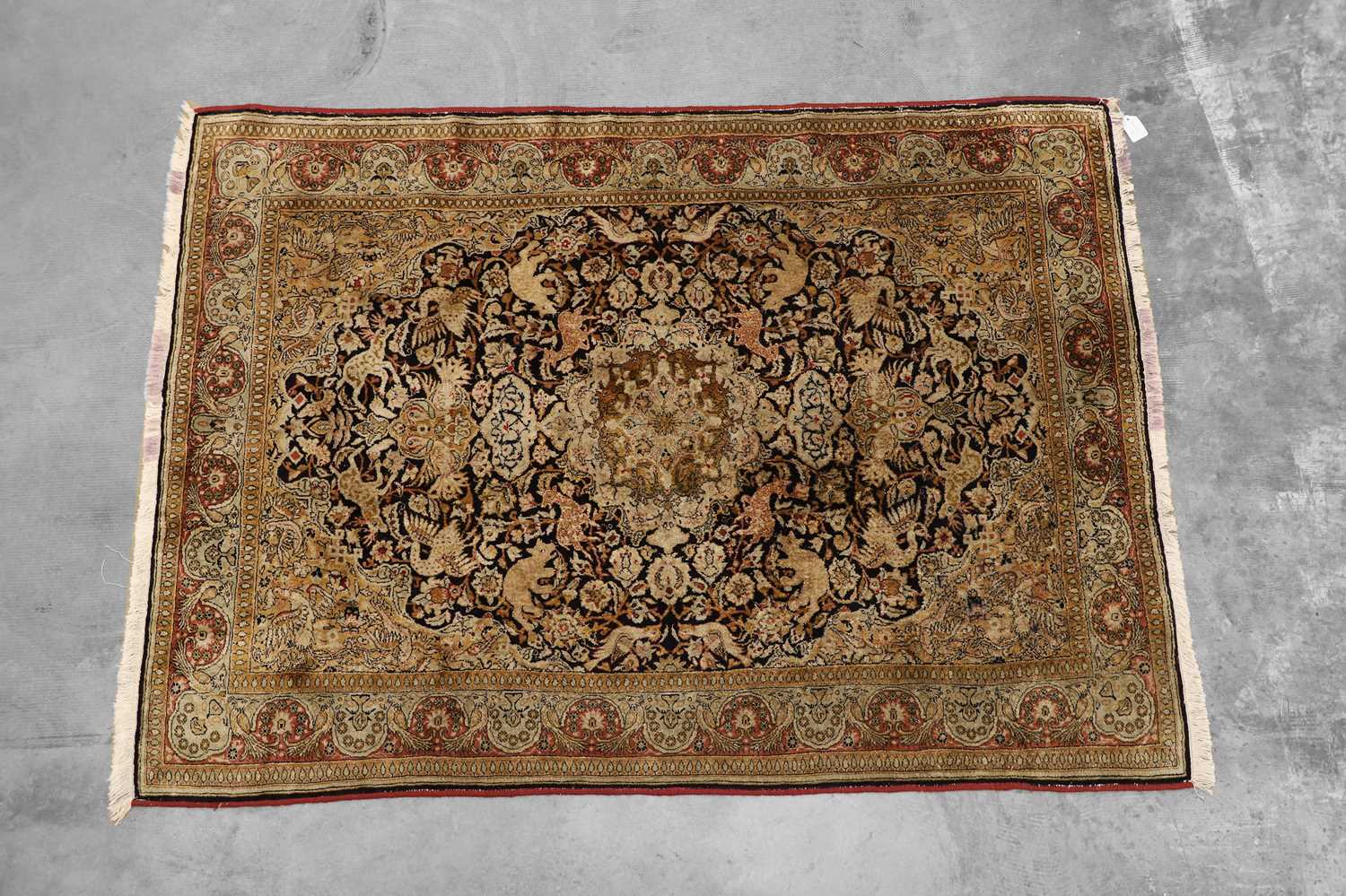 Lot 423 - A Persian silk and wool Qum rug