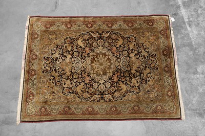 Lot 423 - A Persian silk and wool Qum rug