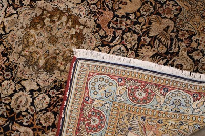 Lot 423 - A Persian silk and wool Qum rug