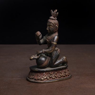 Lot 184 - A painted and parcel-gilt bronze of Krishna