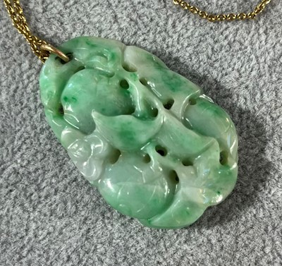 Lot 30 - A carved jade pendant, c.1920s