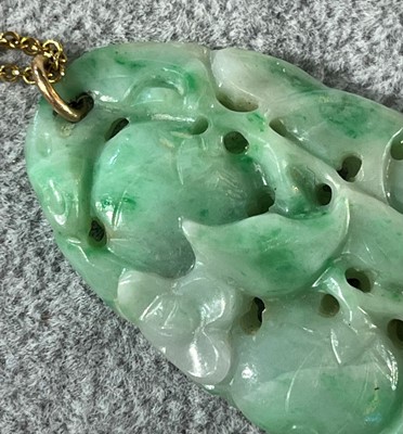 Lot 30 - A carved jade pendant, c.1920s