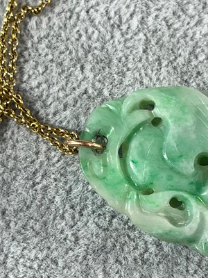 Lot 30 - A carved jade pendant, c.1920s