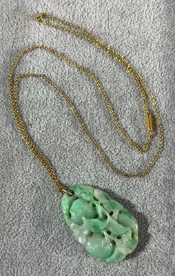 Lot 30 - A carved jade pendant, c.1920s