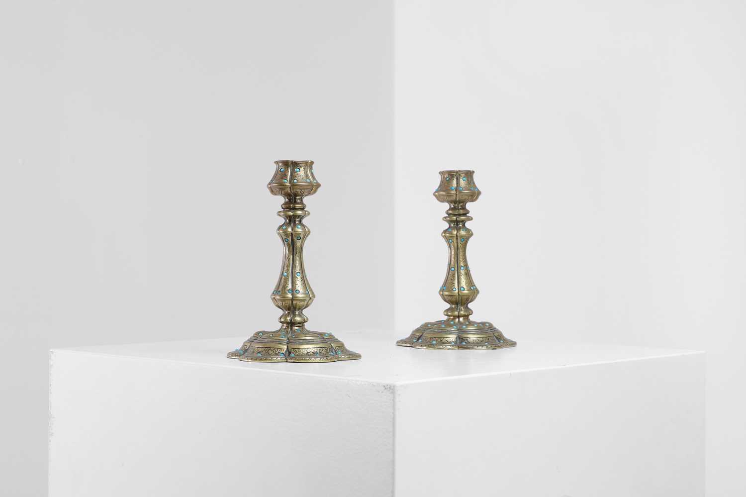 Lot 329 - A pair of small brass candlesticks