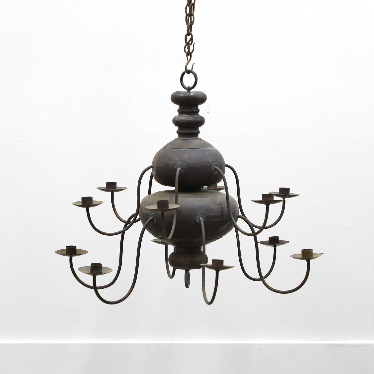 Lot 480 - A Swedish vernacular patinated metal twelve-branch chandelier