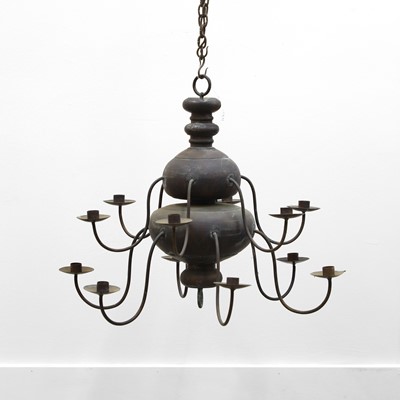 Lot 480 - A Swedish vernacular patinated metal twelve-branch chandelier