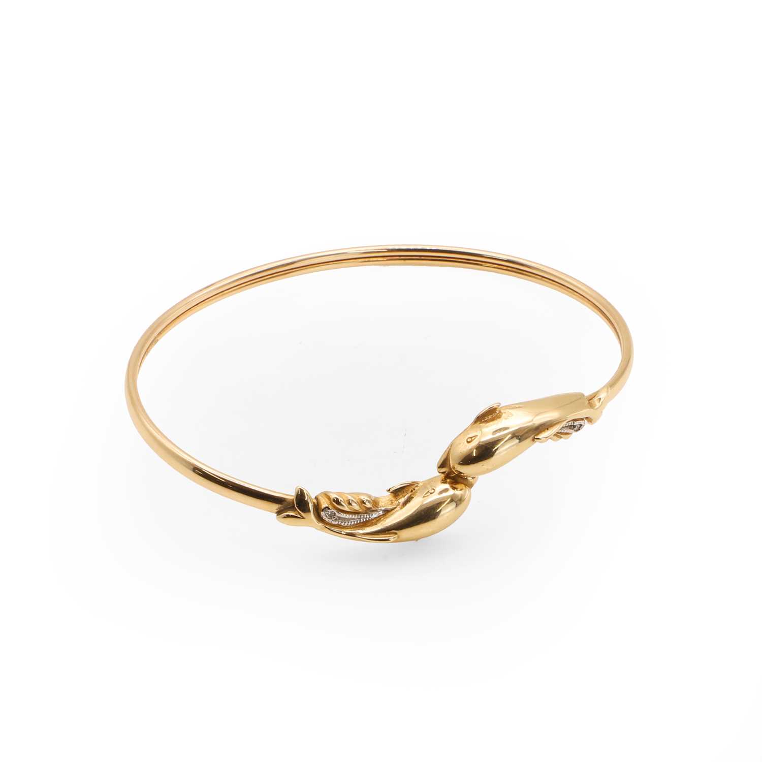Lot 52 - A diamond set gold torque bangle