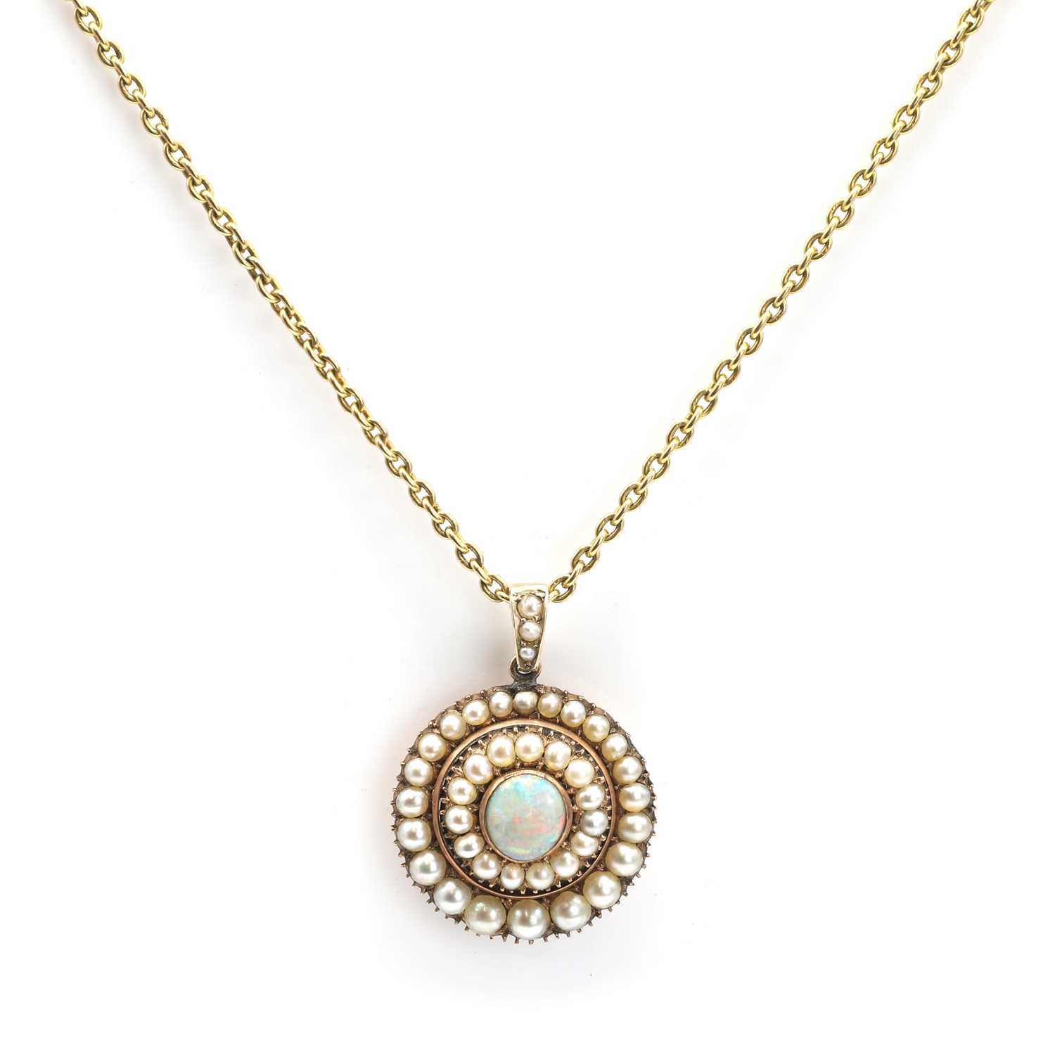 Lot 15 - An opal and seed pearl memorial pendant on chain