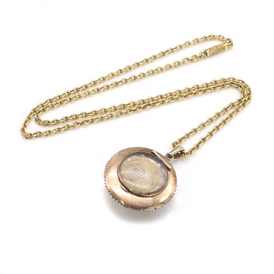 Lot 15 - An opal and seed pearl memorial pendant on chain