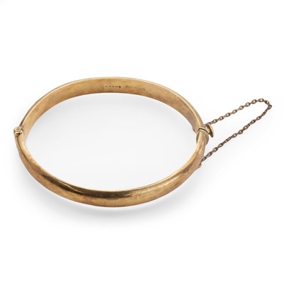 Lot 75 - A 9ct gold hinged bangle