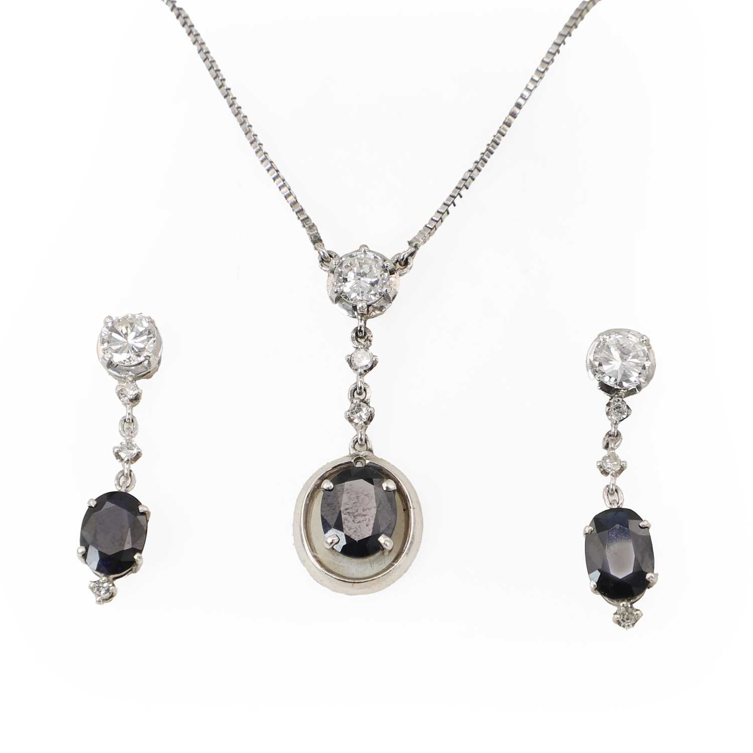 Lot 81 - A white gold sapphire and diamond pendant and drop earrings set