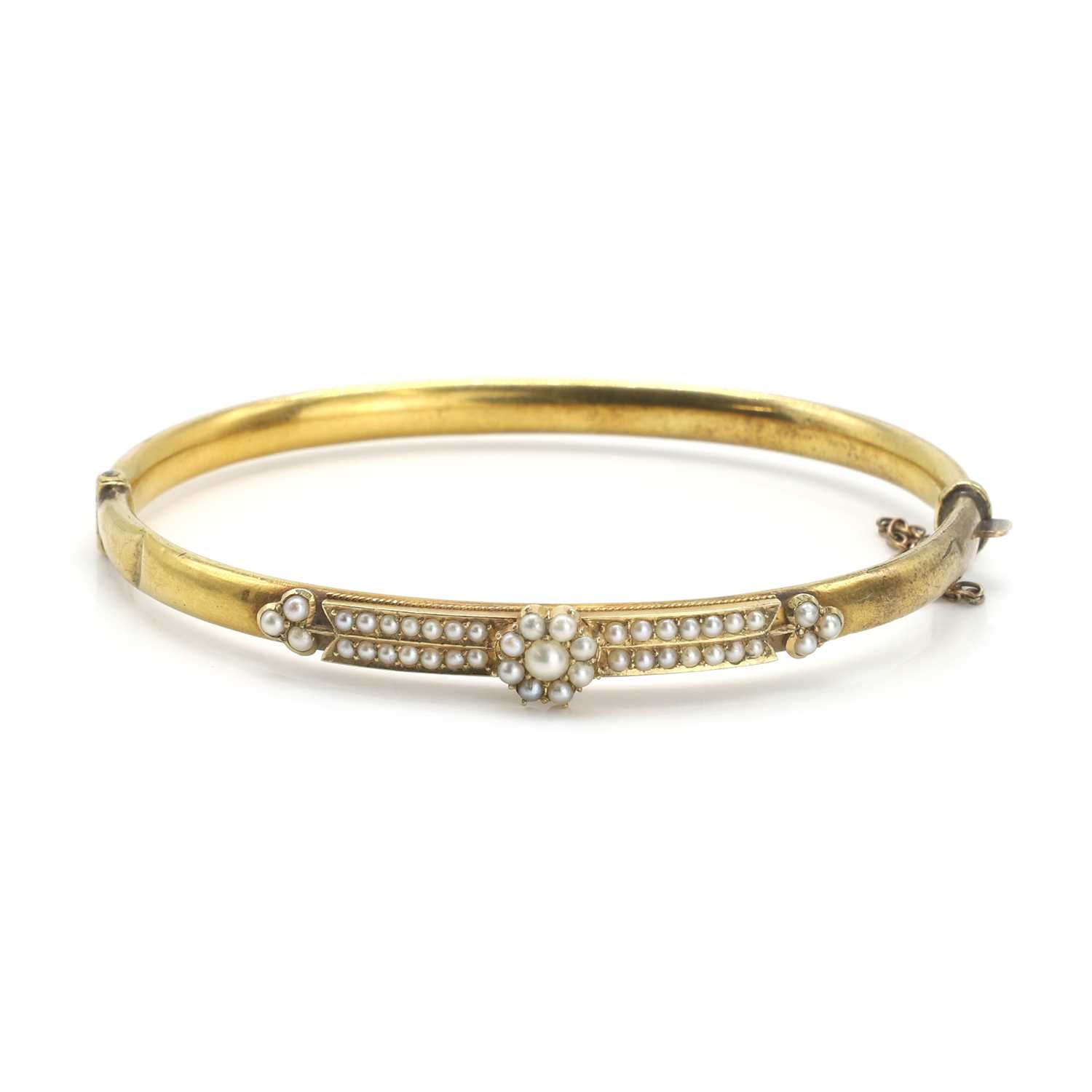Lot 23 - A late Victorian split pearl set bangle
