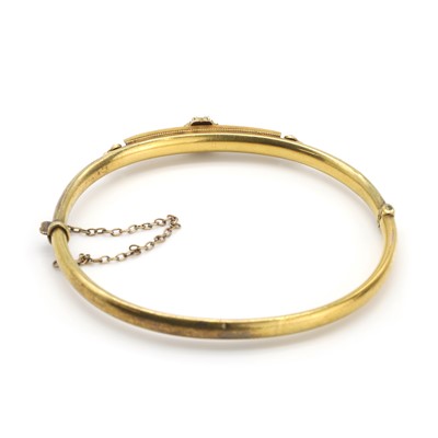 Lot 23 - A late Victorian split pearl set bangle
