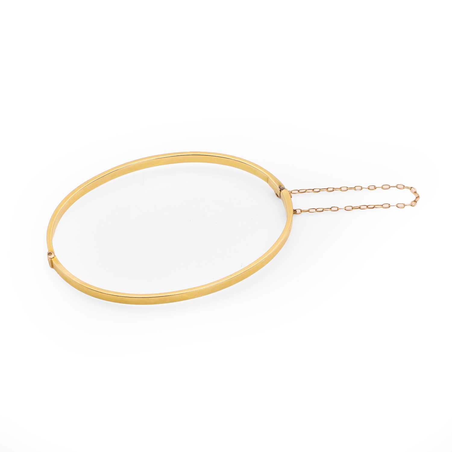 Lot 53 - A gold hinged bangle