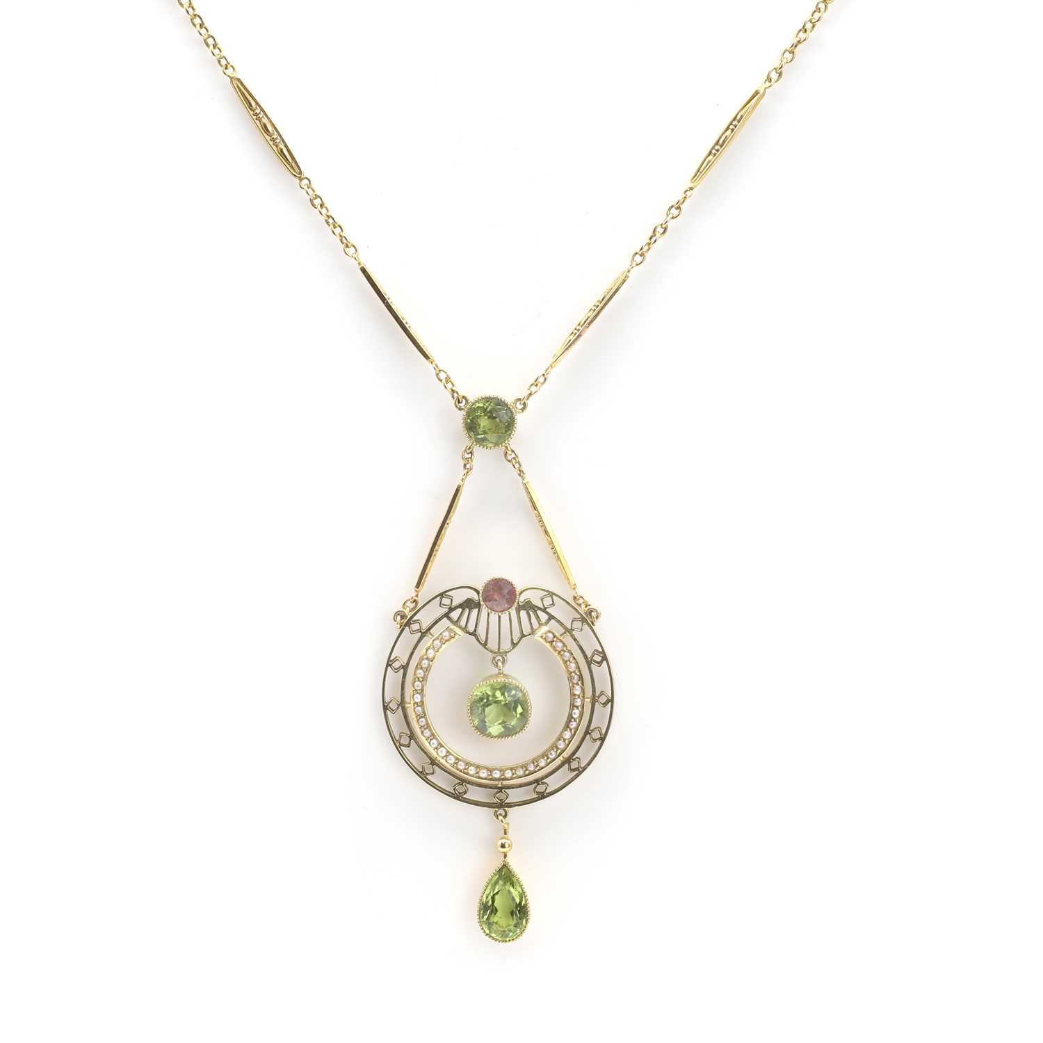Lot 42 - An early 20th century peridot, pink tourmaline, and split pearl pendant necklace