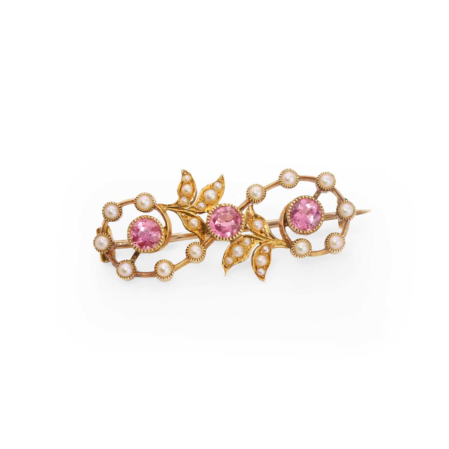 Lot 22 - An Edwardian pink tourmaline and split pearl brooch