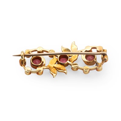Lot 22 - An Edwardian pink tourmaline and split pearl brooch