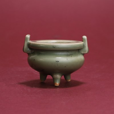 Lot 315 - A Japanese celadon tripod koro
