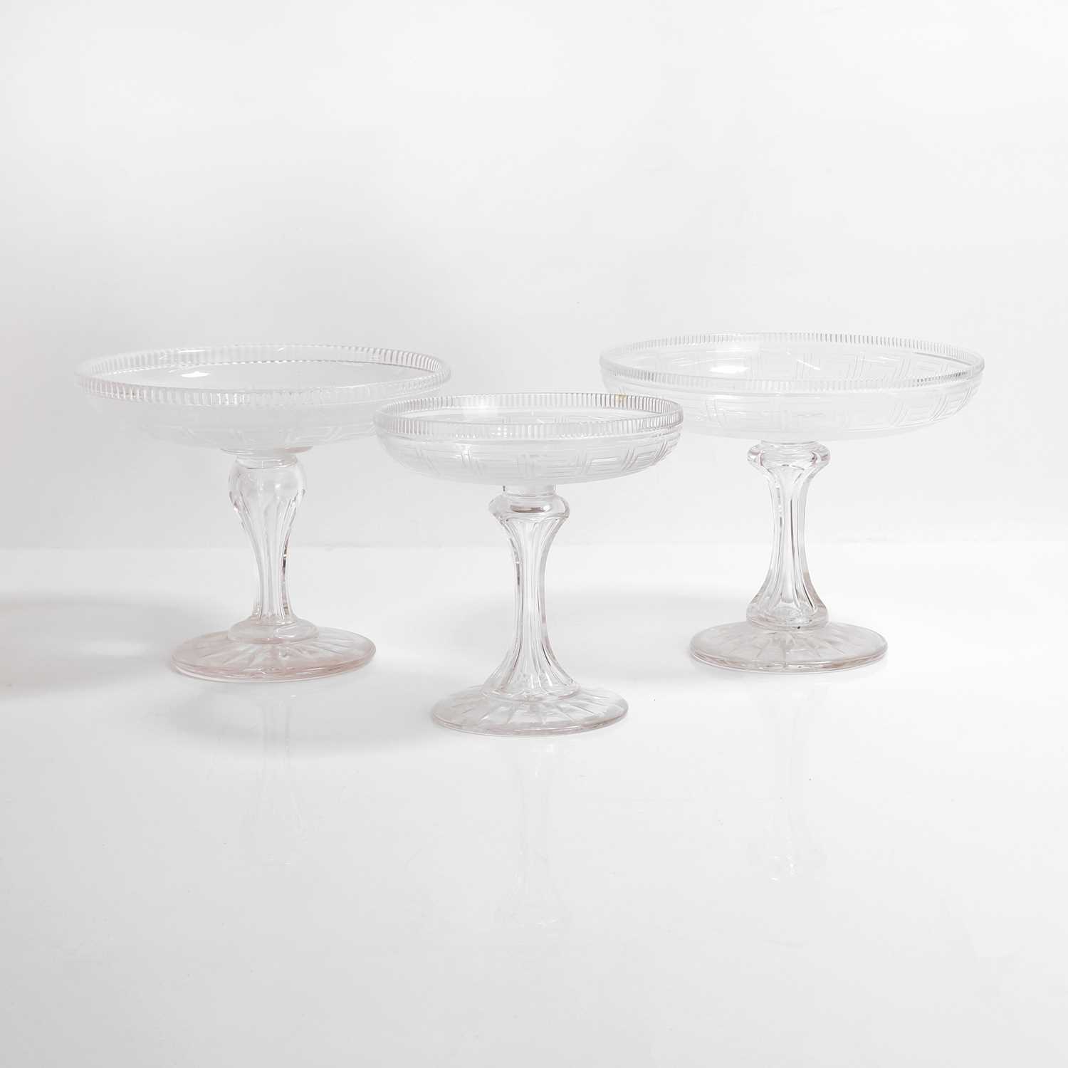 Lot 155 - A composed set of three cut and frosted glass tazzas