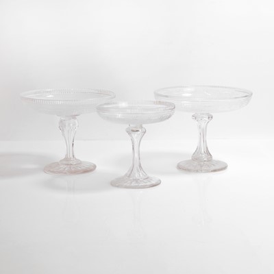 Lot 151 - A composed set of three cut and frosted glass tazzas