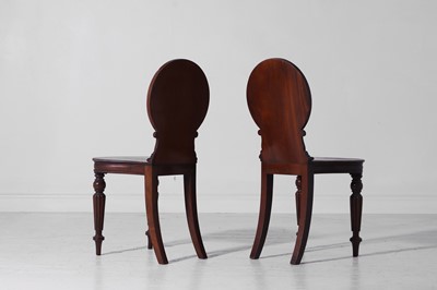 Lot 318 - A pair of Regency mahogany hall chairs