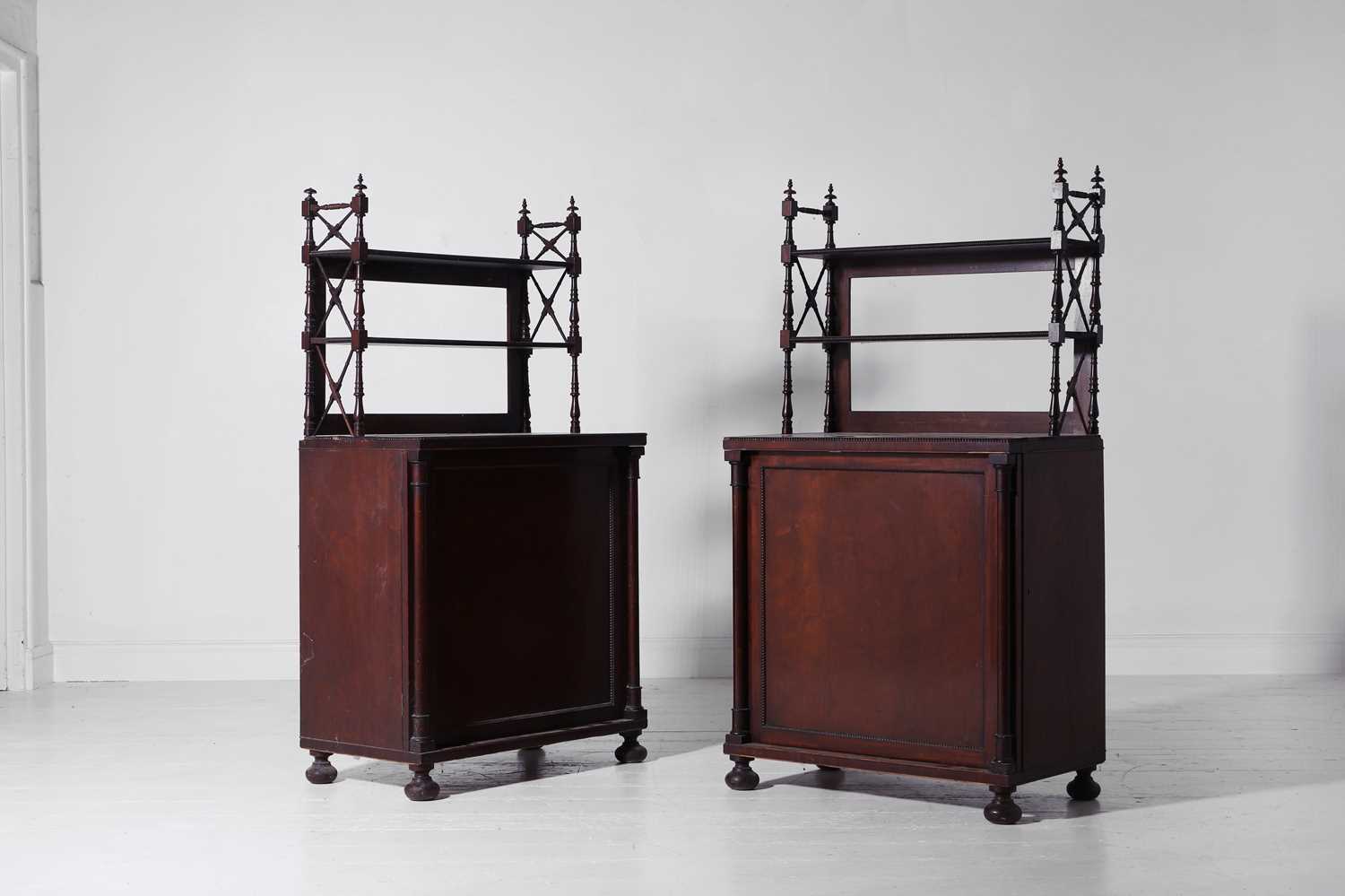 Lot 331 - A pair of Regency mahogany cupboards