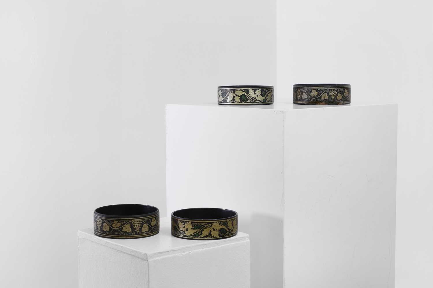 Lot 366 - Two pairs of Regency papier mâché coasters