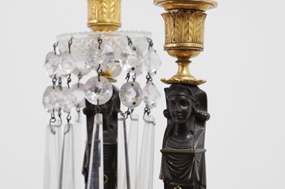 Lot 334 - A pair of Regency Egyptian Revival candelabra