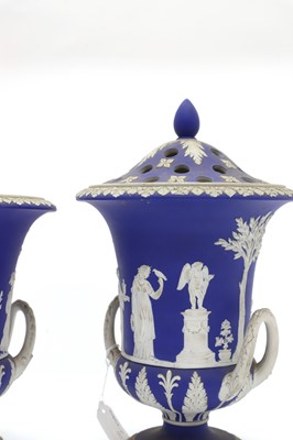 Lot 75 - A pair of Wedgwood Jasperware pot pourri urns and covers