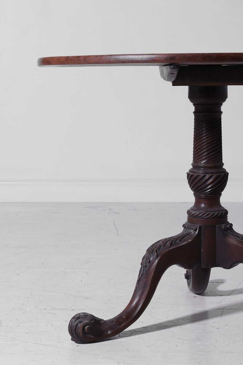 Lot 399 - A George II mahogany tripod table