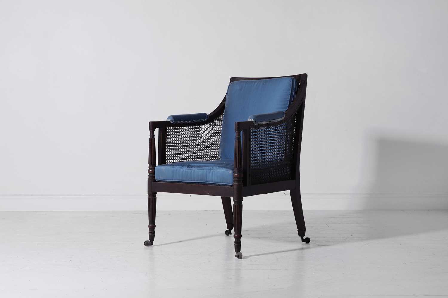 Lot 308 - A Regency mahogany bergère library armchair