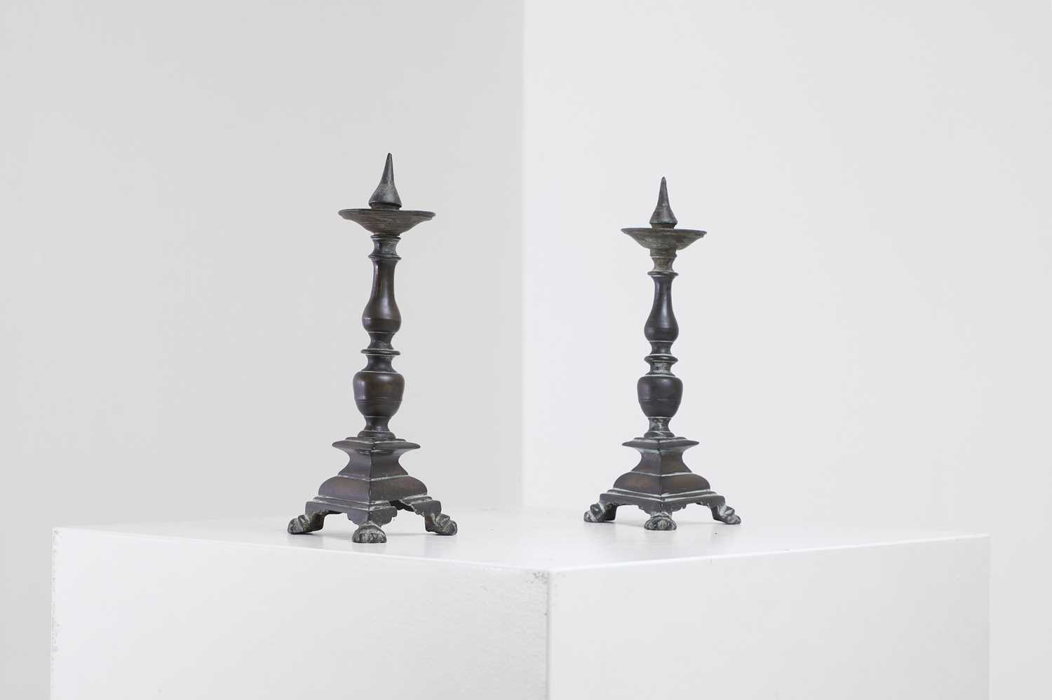 Lot 348 - A pair of bronze pricket candlesticks